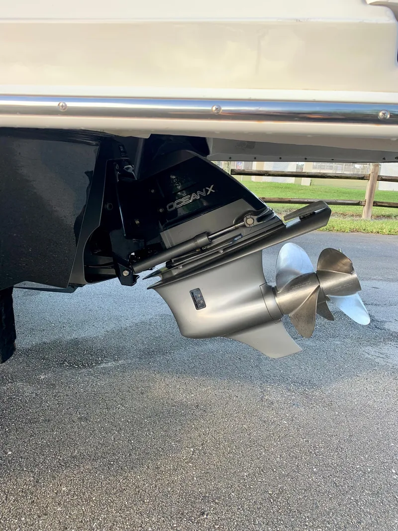 Slide: The Image of 2016 Regal Fastrac boat outdrive and propeller on pavement. - 17