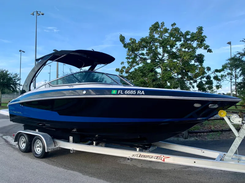 Slide: The Image of 2016 Regal Fastrac boat on trailer, side view. - 2