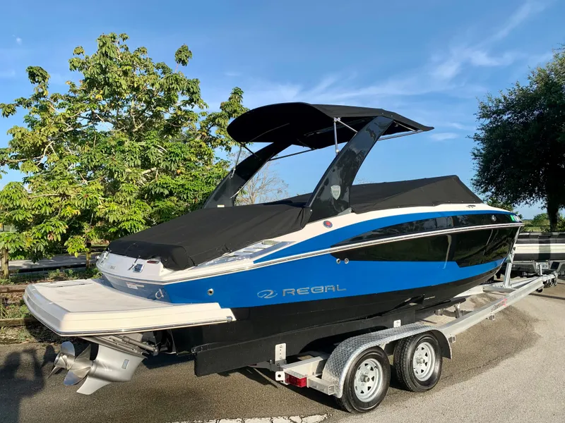 Slide: The Image of 2016 Regal Fastrac boat on a trailer, covered and ready for transport. - 23