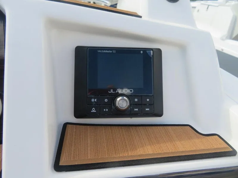 Slide: The Image of 2023 Starcraft SVX OB 231 OB JL Audio system on dashboard. - 11