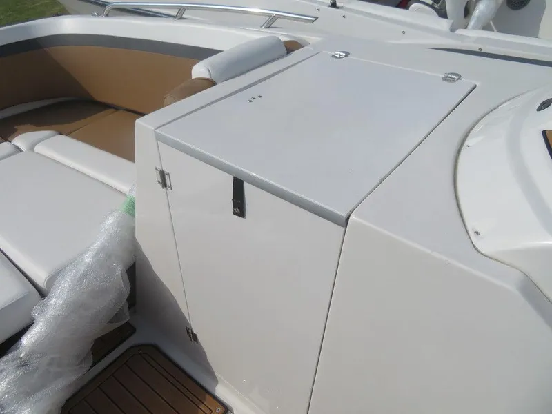 Slide: The Image of 2023 Starcraft SVX OB 231 OB boat interior with seating and storage compartment. - 16