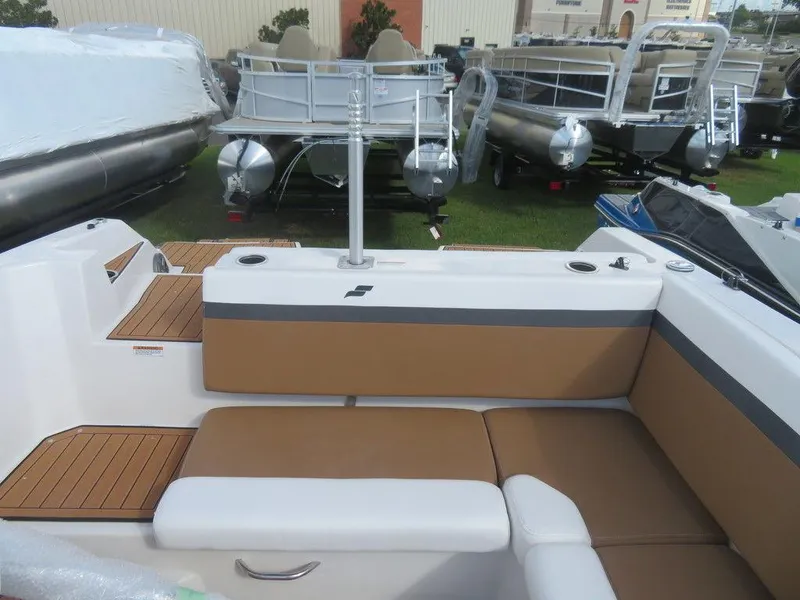 Slide: The Image of 2023 Starcraft SVX OB 231 OB boat interior with tan and white seating. - 5