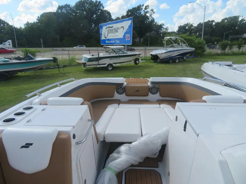 Slide: The Image of 2023 Starcraft SVX OB 231 OB boat interior with seating and cup holders. - 9