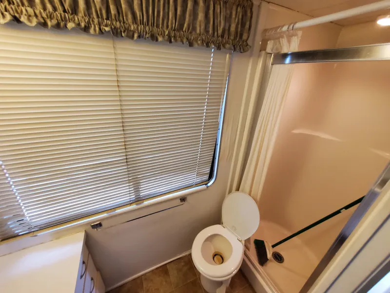 Slide: The Image of Bathroom interior of a 1995 Skipperliner 55x15 Houseboat with shower and toilet. - 21