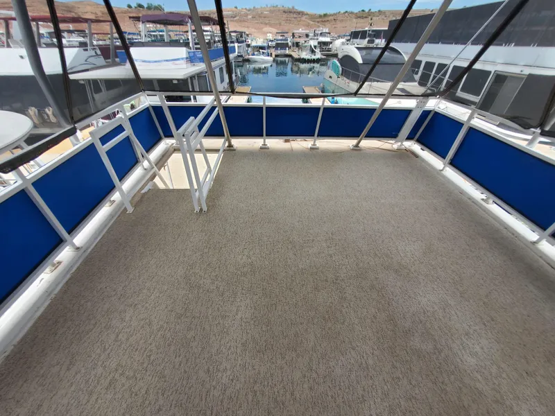 Slide: The Image of Upper deck of a 1995 Skipperliner 55x15 Houseboat with marina view. - 30