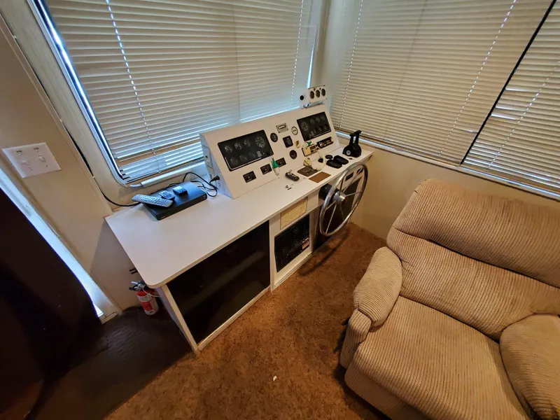 Slide: The Image of Control panel of a 1995 Skipperliner 55x15 Houseboat with beige seating. - 7