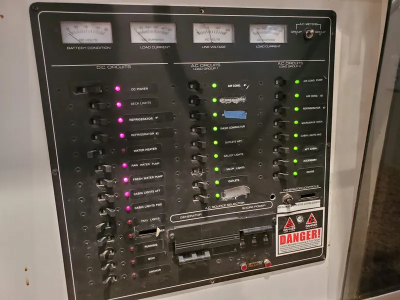 Slide: The Image of Control panel of a 1995 Skipperliner 55x15 Houseboat with various switches and indicators. - 8