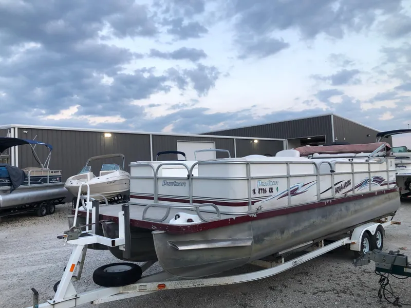 Slide: The Image of 2008 PlayCraft 2600 Clipper pontoon boat on a trailer in a storage yard. - 3