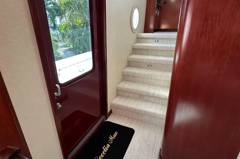 Slide: The Image of Interior stairs and door of 2015 Broward Raised Pilothouse M/Y yacht. - 27
