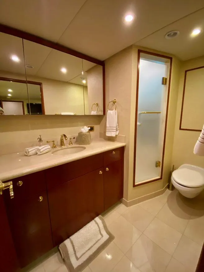 Slide: The Image of Luxurious bathroom on 2015 Broward Raised Pilothouse M/Y yacht with elegant fixtures. - 34