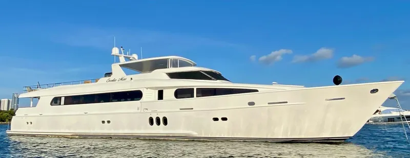 Slide: The Image of Luxurious 2015 Broward Raised Pilothouse M/Y yacht on calm water under clear blue sky. - 4