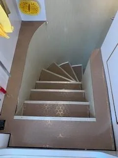 Slide: The Image of Staircase inside 2015 Broward Raised Pilothouse M/Y yacht, featuring brown steps and compact design. - 48