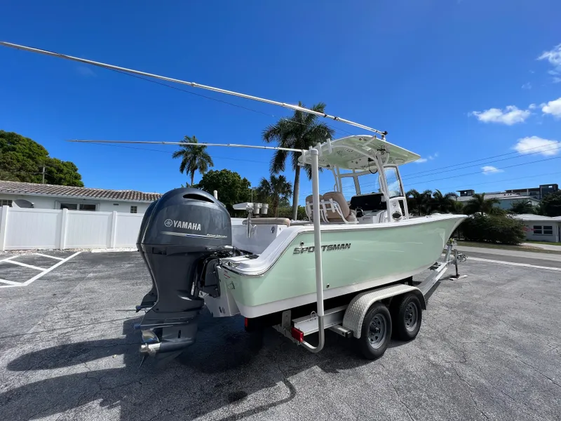 Slide: The Image of 2020 Sportsman Heritage 251 Center Console boat on trailer with Yamaha engine. - 1