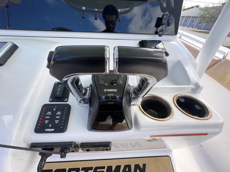 Slide: The Image of Control panel of a 2020 Sportsman Heritage 251 Center Console boat with Yamaha throttle. - 11