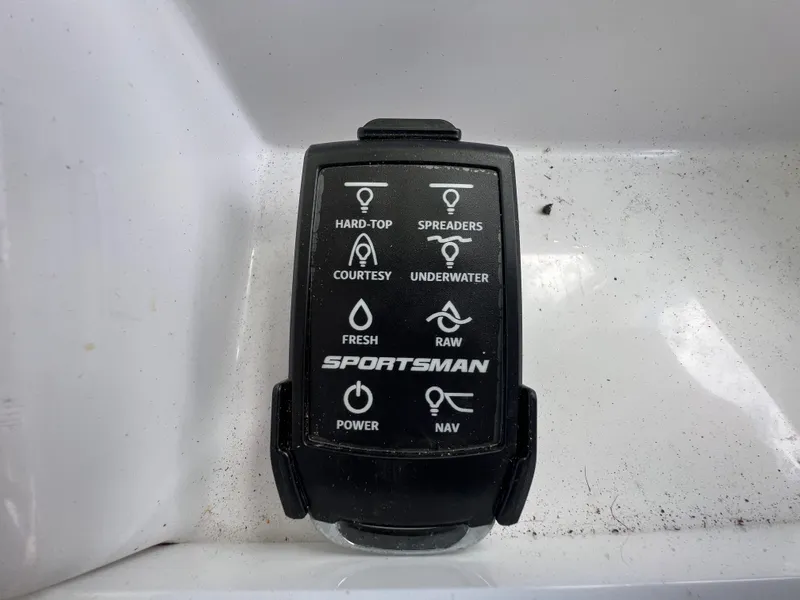 Slide: The Image of Control panel of a 2020 Sportsman Heritage 251 Center Console boat. - 13