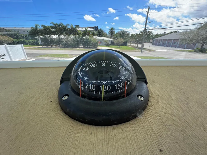 Slide: The Image of Compass on a 2020 Sportsman Heritage 251 Center Console boat. - 15