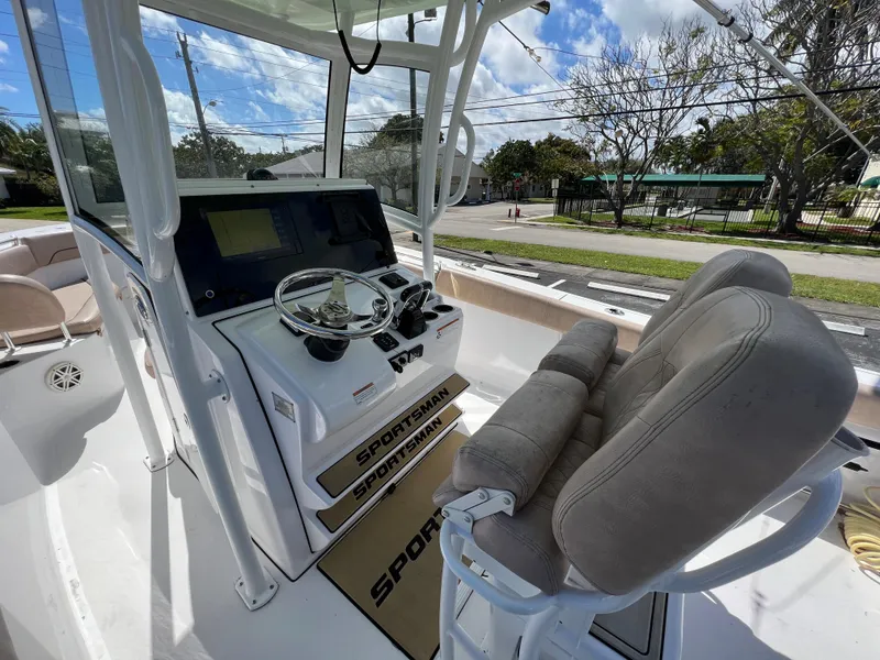 Slide: The Image of 2020 Sportsman Heritage 251 Center Console boat interior with helm and seating. - 16