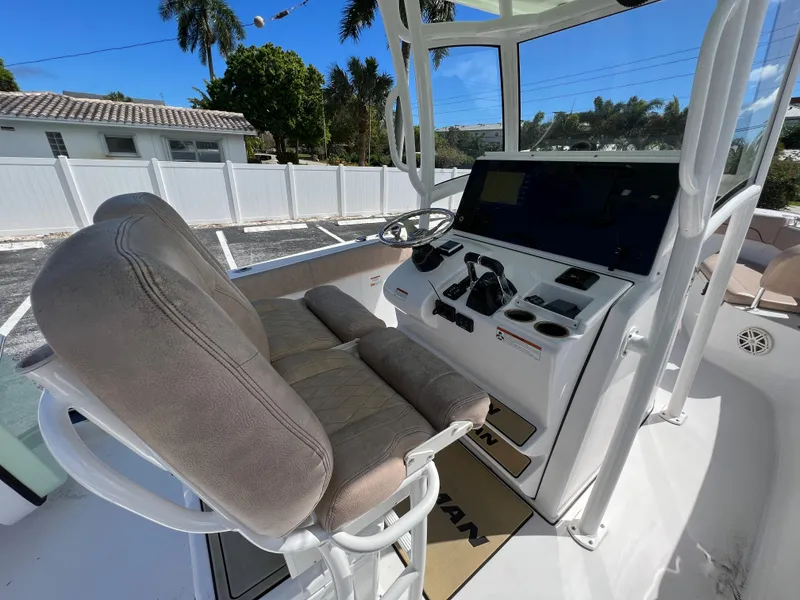 Slide: The Image of 2020 Sportsman Heritage 251 Center Console boat interior with helm and seating. - 17
