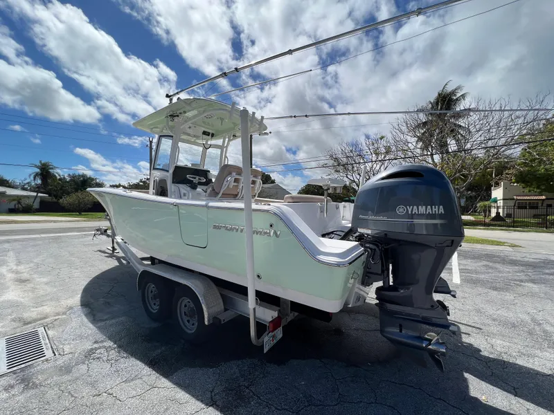 Slide: The Image of 2020 Sportsman Heritage 251 Center Console boat on trailer with Yamaha outboard motor. - 2