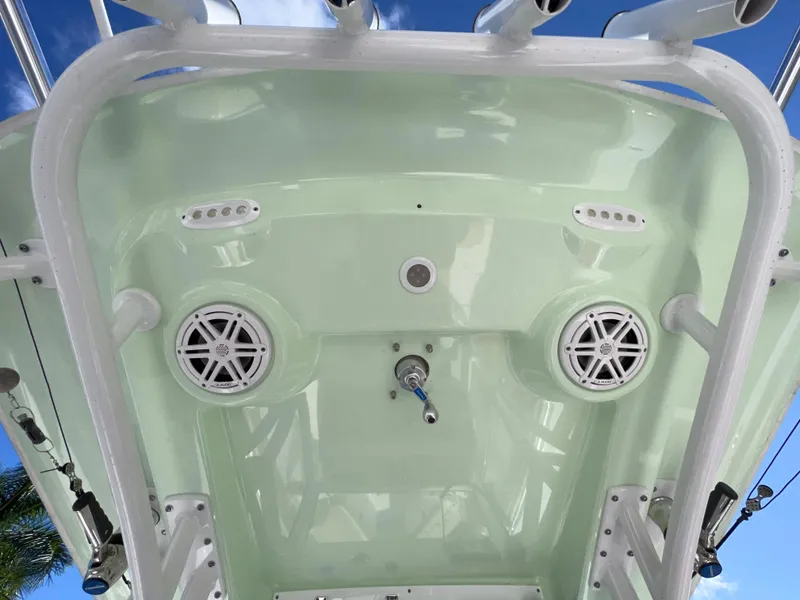 Slide: The Image of 2020 Sportsman Heritage 251 Center Console boat with speakers and rod holders. - 20