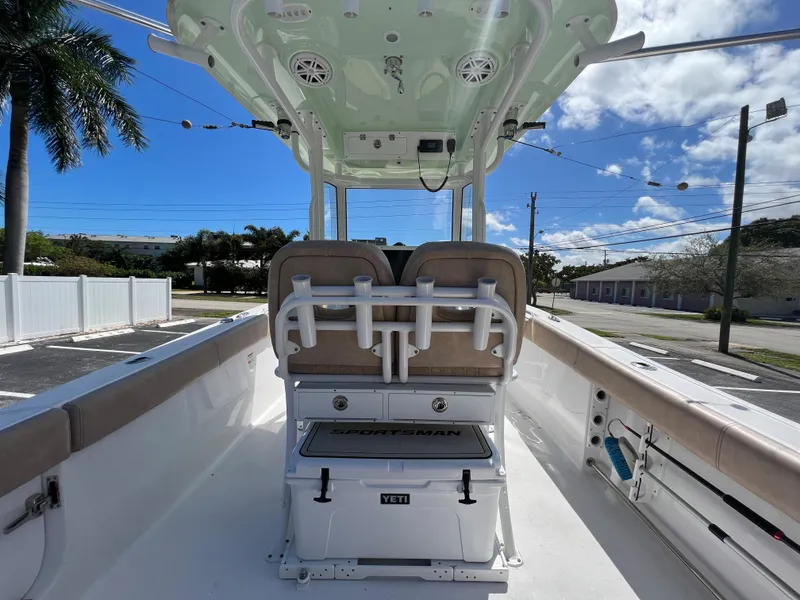 Slide: The Image of 2020 Sportsman Heritage 251 Center Console boat interior with seating and Yeti cooler. - 22