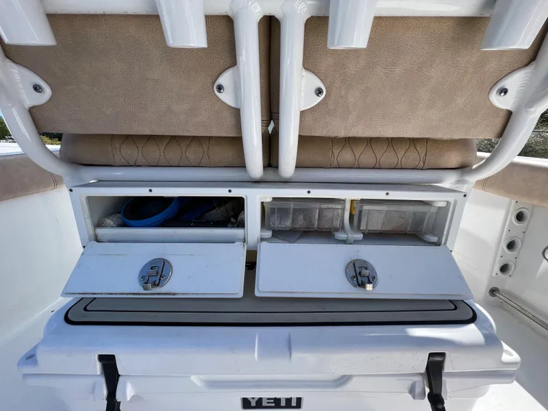 Slide: The Image of 2020 Sportsman Heritage 251 Center Console storage compartments and Yeti cooler. - 23
