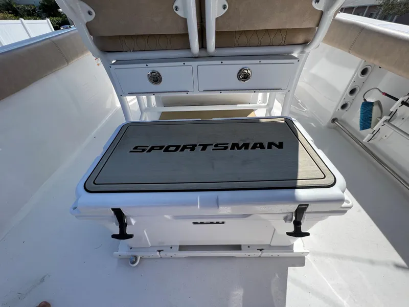 Slide: The Image of 2020 Sportsman Heritage 251 Center Console boat interior with storage and seating. - 24
