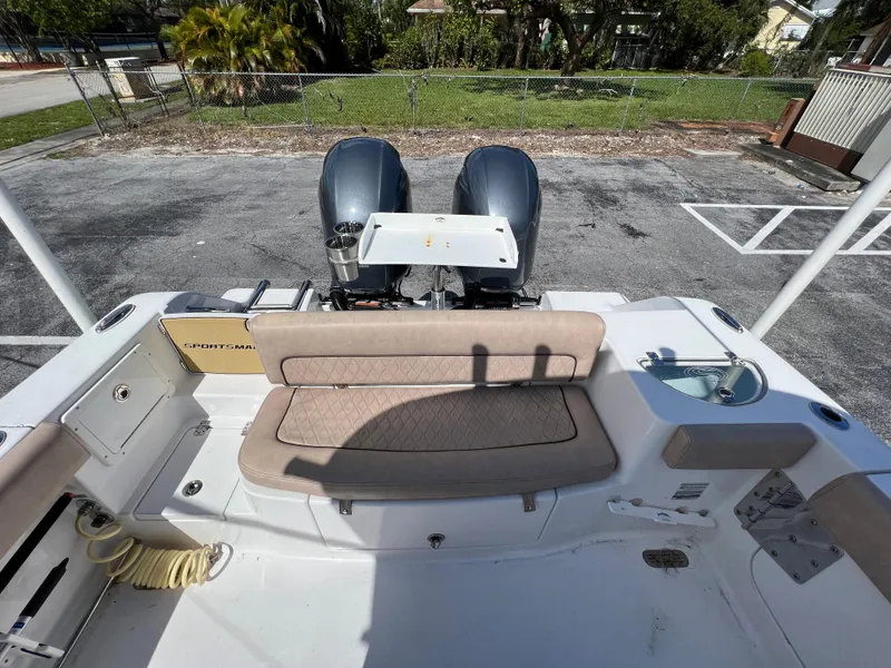 Slide: The Image of 2020 Sportsman Heritage 251 Center Console boat with twin engines and rear seating. - 25