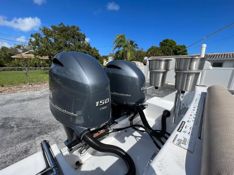 Slide: The Image of 2020 Sportsman Heritage 251 Center Console with twin 150 horsepower outboard engines. - 28