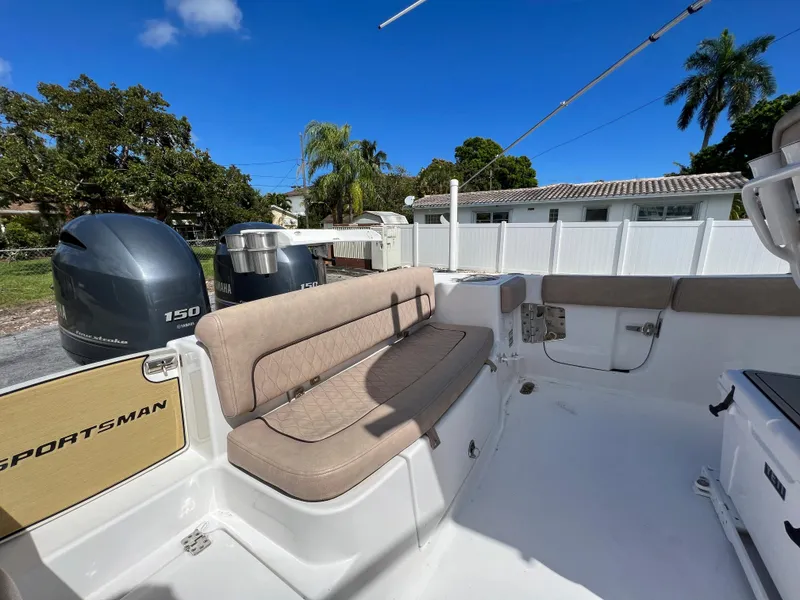 Slide: The Image of 2020 Sportsman Heritage 251 Center Console boat with seating and twin 150 HP engines. - 29