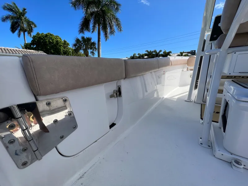 Slide: The Image of 2020 Sportsman Heritage 251 Center Console boat interior with cushioned seating. - 35