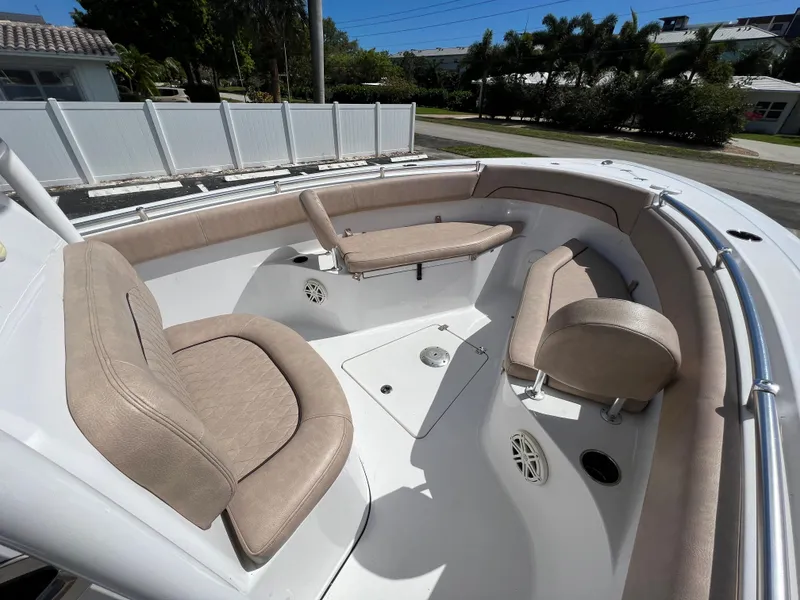Slide: The Image of 2020 Sportsman Heritage 251 Center Console boat with beige seating and spacious deck. - 37