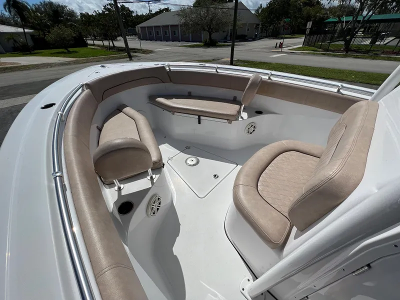 Slide: The Image of 2020 Sportsman Heritage 251 Center Console boat with beige seating and spacious deck. - 38