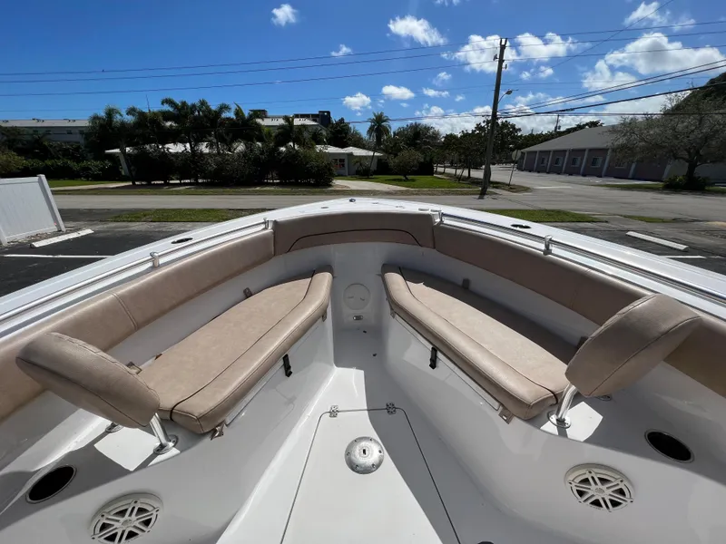 Slide: The Image of 2020 Sportsman Heritage 251 Center Console boat with beige seating and spacious deck. - 39