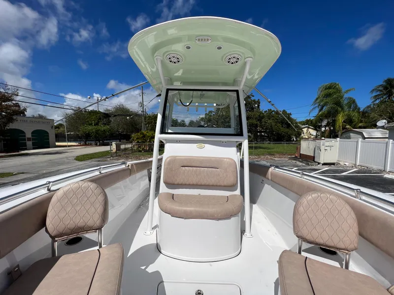 Slide: The Image of 2020 Sportsman Heritage 251 Center Console boat with cushioned seating. - 40