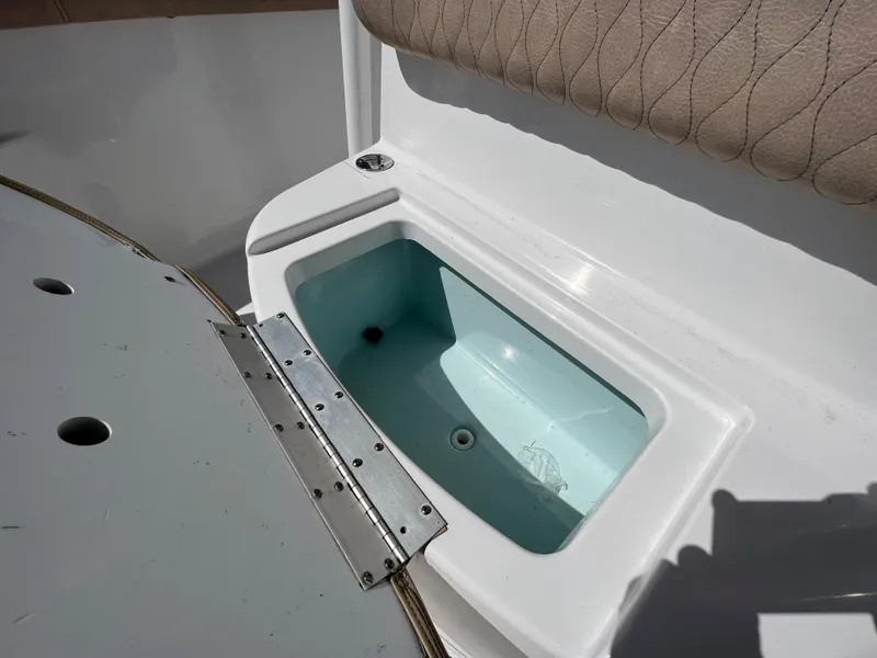 Slide: The Image of Livewell compartment on a 2020 Sportsman Heritage 251 Center Console boat. - 48