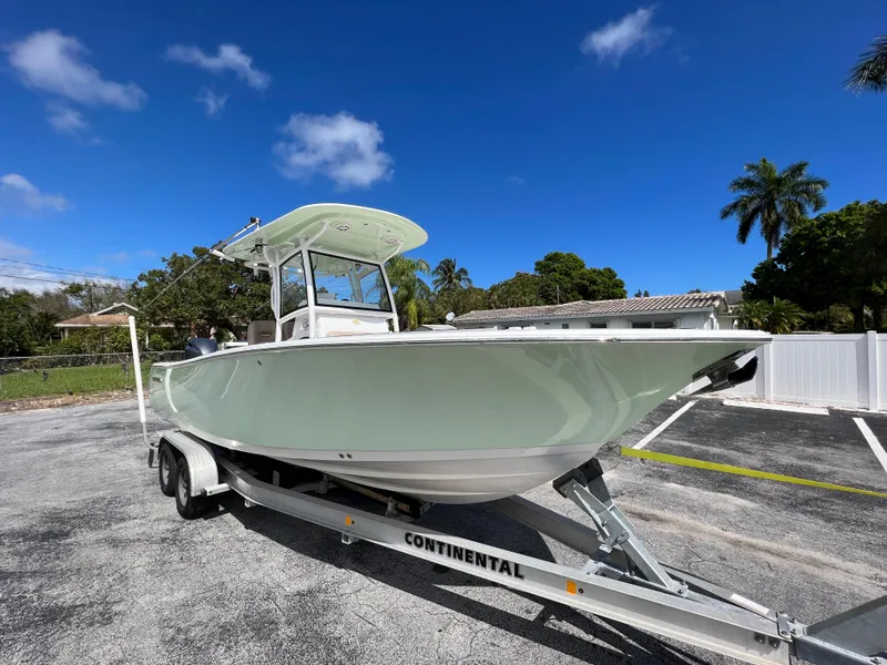 Slide: The Image of 2020 Sportsman Heritage 251 Center Console boat on a Continental trailer. - 7