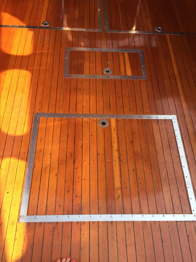 Slide: The Image of 1954 Chris-Craft Commander wooden deck with metal-framed hatches. - 23