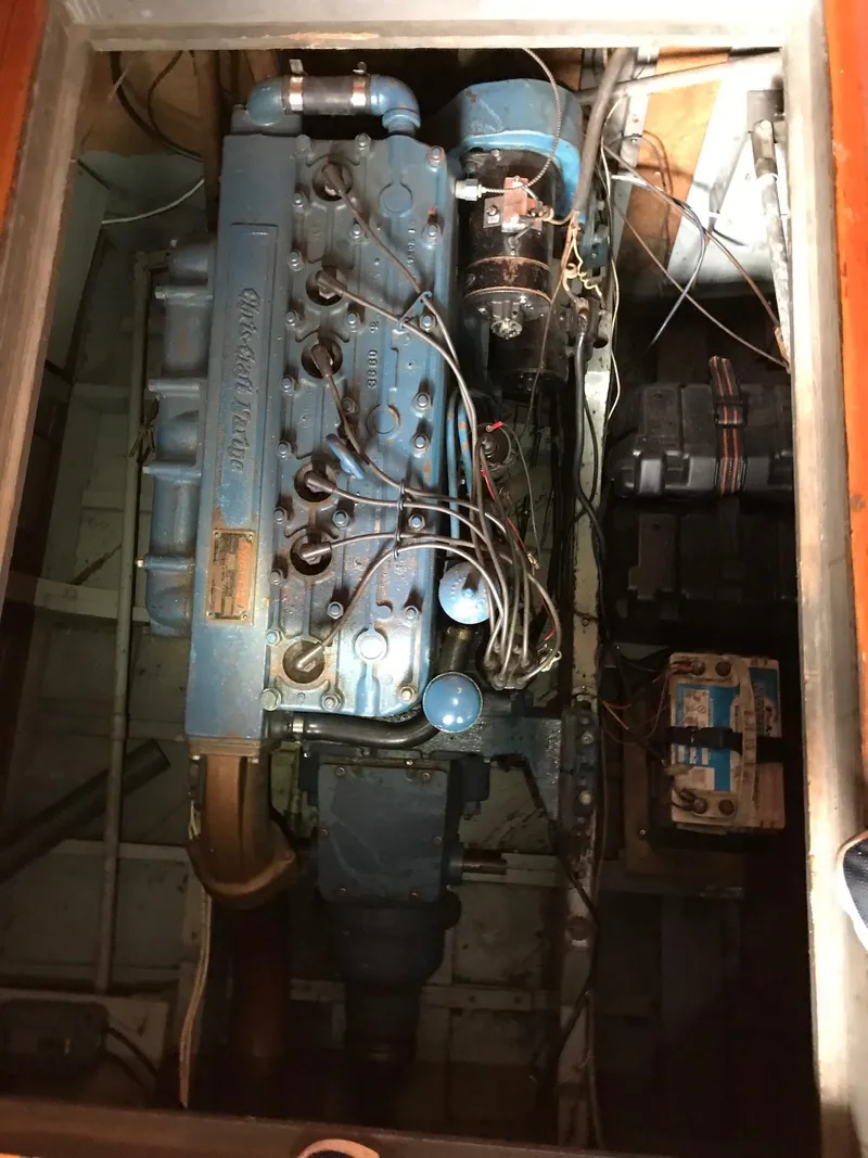 Slide: The Image of 1954 Chris-Craft Commander engine compartment with visible wiring and components. - 28
