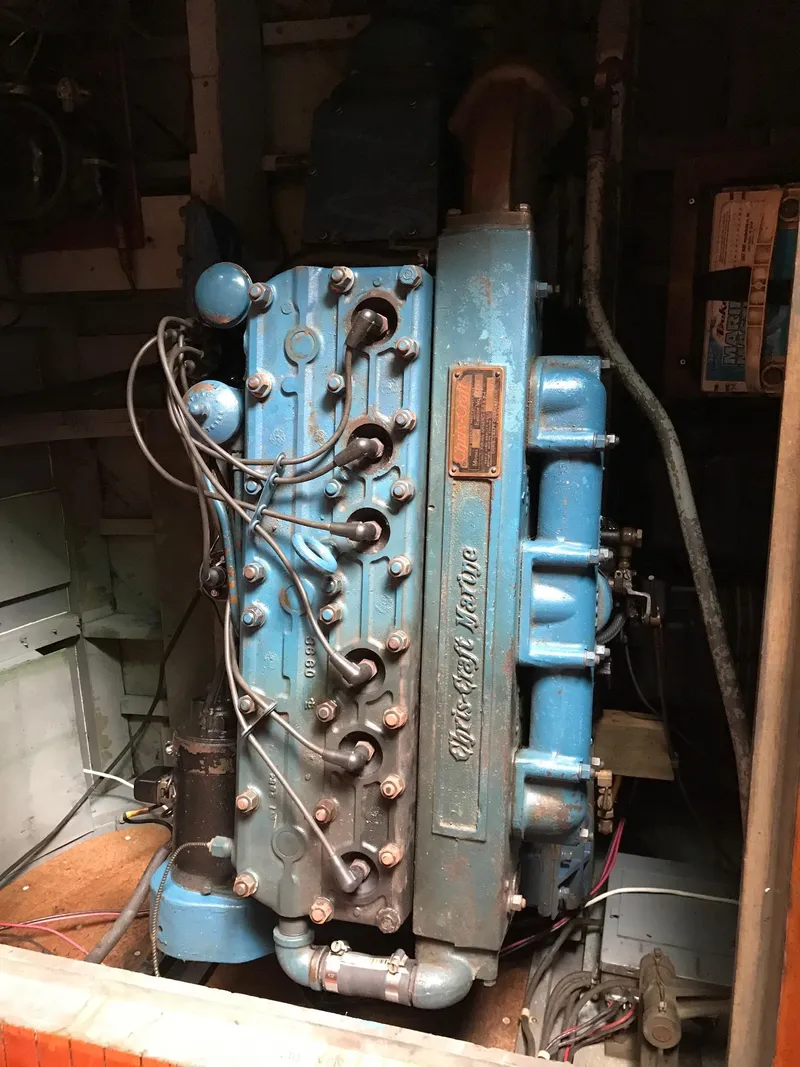Slide: The Image of 1954 Chris-Craft Commander engine, vintage blue machinery in a boat's engine room. - 30
