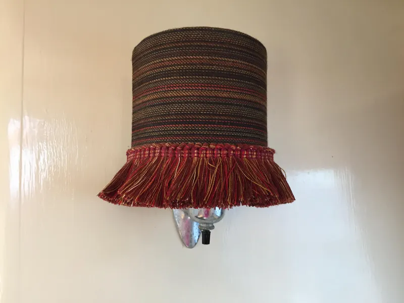 Slide: The Image of Vintage wall lamp with a fringed shade on a 1954 Chris-Craft Commander boat. - 9