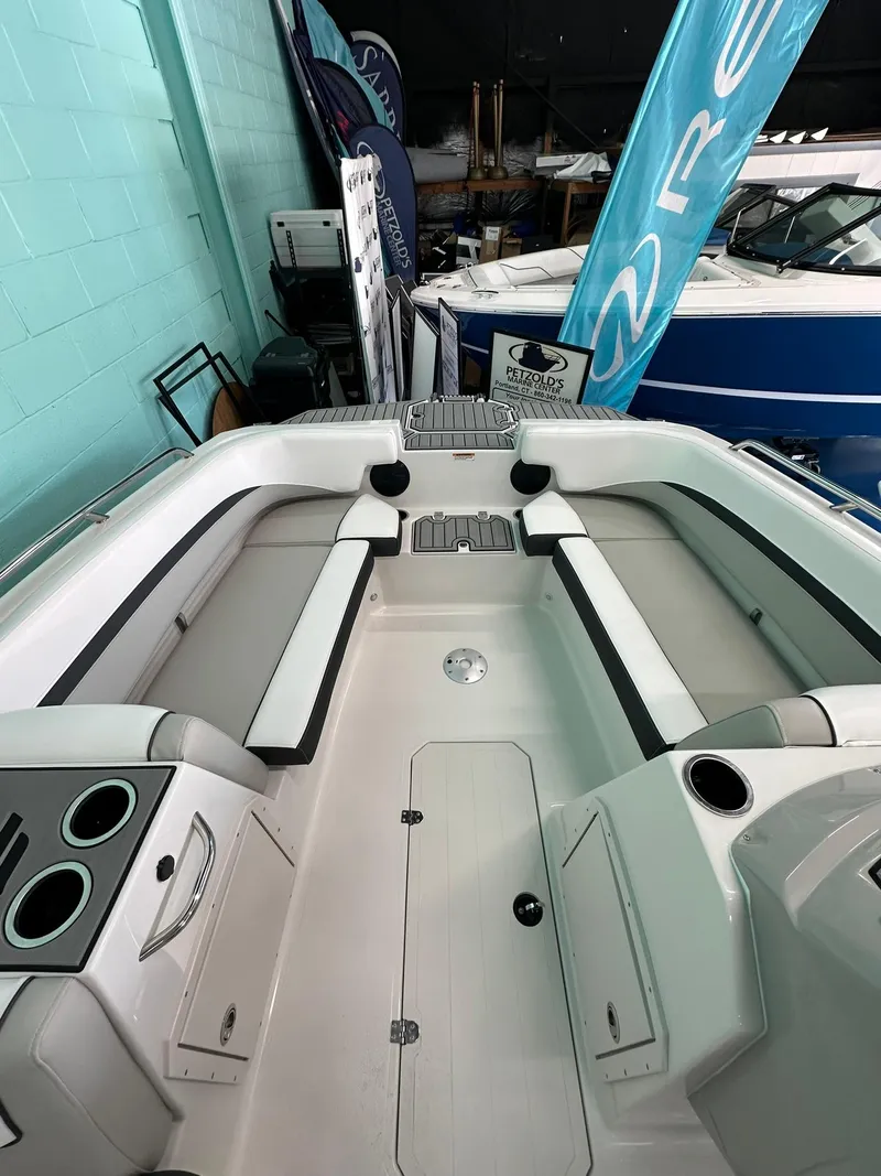 Slide: The Image of 2025 Starcraft SVX 211 OB boat dashboard with steering wheel and gauges. - 14