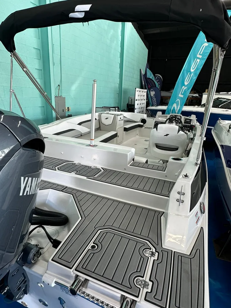Slide: The Image of 2025 Starcraft SVX 211 OB boat with Yamaha engine in showroom. - 5
