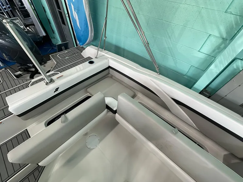 Slide: The Image of 2025 Starcraft SVX 211 OB boat interior with modern seating and controls. - 8