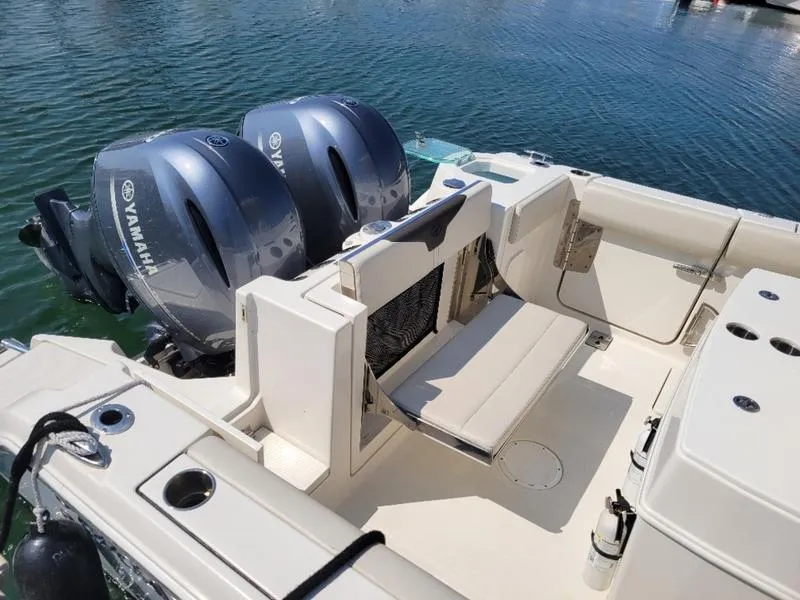 Slide: The Image of 2023 Sailfish 272 CC boat with Yamaha engines on calm water. - 6