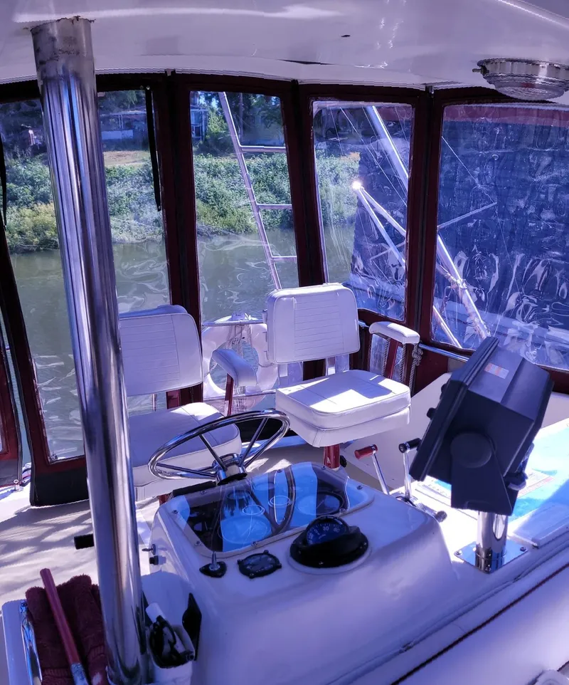 Slide: The Image of 1983 Ocean Yachts Super Sport interior with steering wheel and seating. - 20