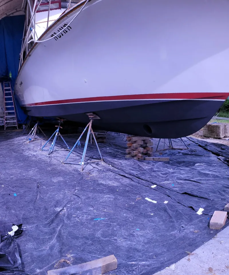 Slide: The Image of 1983 Ocean Yachts Super Sport boat on stands for maintenance. - 29