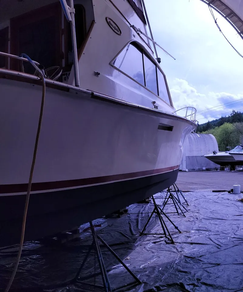 Slide: The Image of 1983 Ocean Yachts Super Sport boat on stands for maintenance. - 32