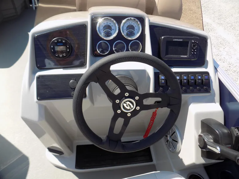 Slide: The Image of 2022 Sylvan Mirage Fish 8522 Party Fish dashboard with steering wheel and gauges. - 10