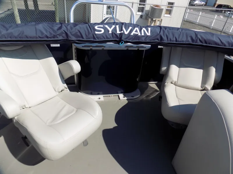Slide: The Image of 2022 Sylvan Mirage Fish 8522 Party Fish boat interior with white seating. - 11